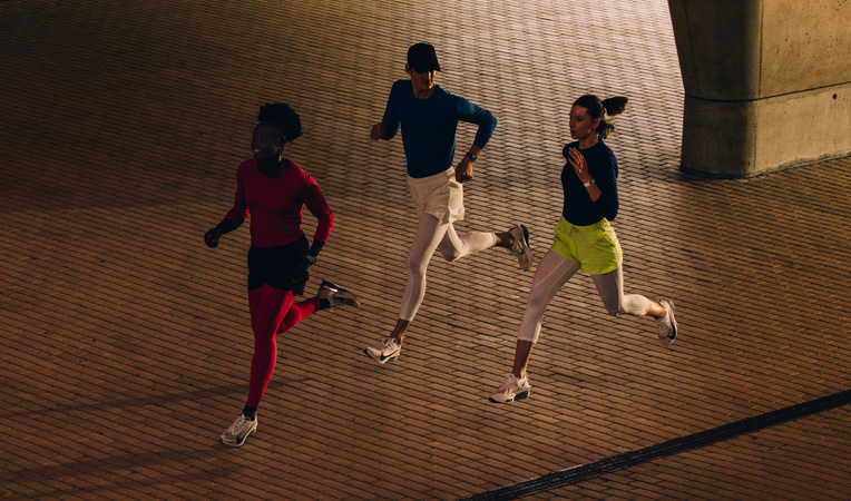 Two people run while wearing Apple Watch Series 11