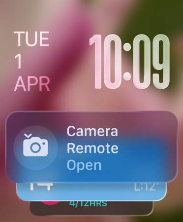 Remote Camera widget appears at bottom of screen, translucent time numerals top right, date top left