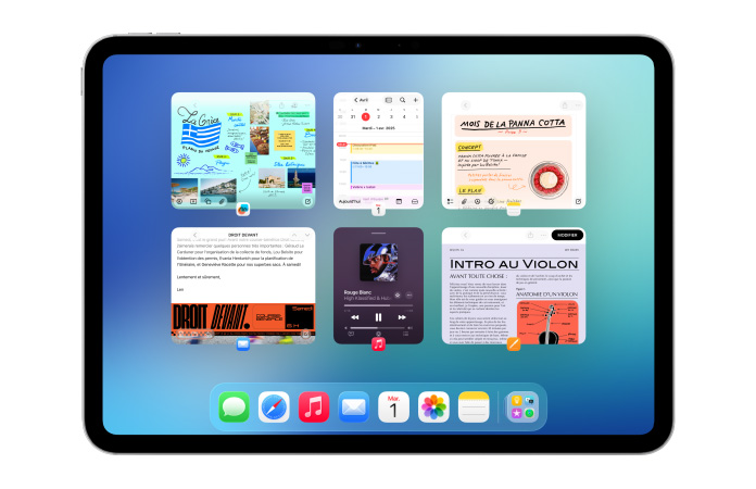 iPad, orientation paysage, l’écran affiche plusieurs apps, dont Calendrier et Musique, disposées c?te à c?te en six fenêtres alignées sur deux rangées