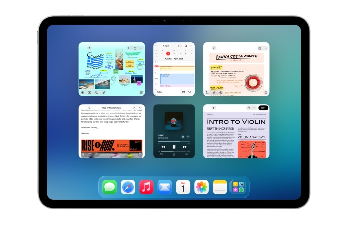 iPad, orientace na ?í?ku, na obrazovce je několik aplikací jako Kalendá? a Hudba v souměrném uspo?ádání ?esti oken ve dvou ?adách