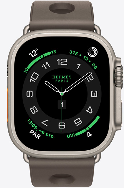 Apple Watch Hermès Ultra 3, Titangeh?use, Farbe Natur, Hermès Circulaire Zifferblatt, Komplikationen: Wetter, Aktivit?tsringe, PAR, UV Index, Geh?use rechts, Digital Crown, Mikrofon, erh?hte Seitentaste, Scub’H Diving Armband, Farbe Gris Titane