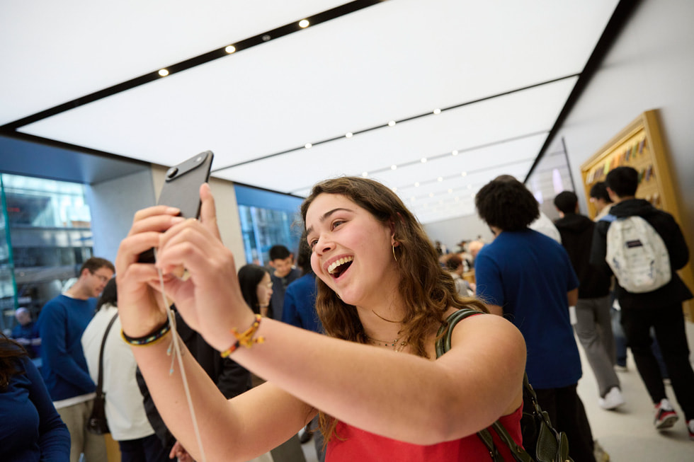 A happy customer takes a selfie using iPhone Air inside Apple Sydney in Sydney, Australia.