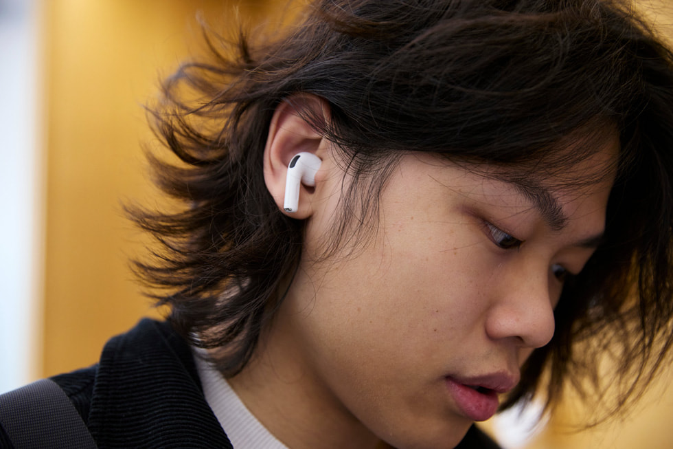 A customer tests out AirPods Pro 3 at the Apple Sydney store in Sydney, Australia.