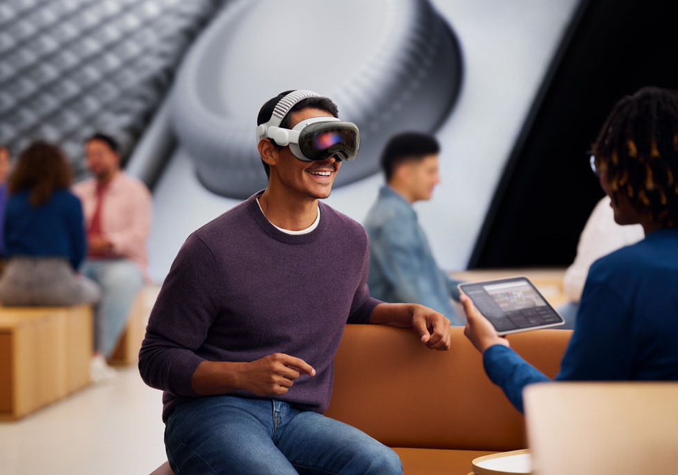 A customer demos Apple Vision Pro at an Apple Store.