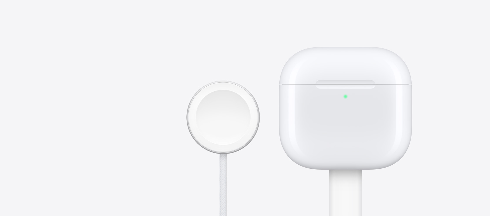 Etui ?aduj?ce AirPods 4 obok ?adowarki Apple Watch.