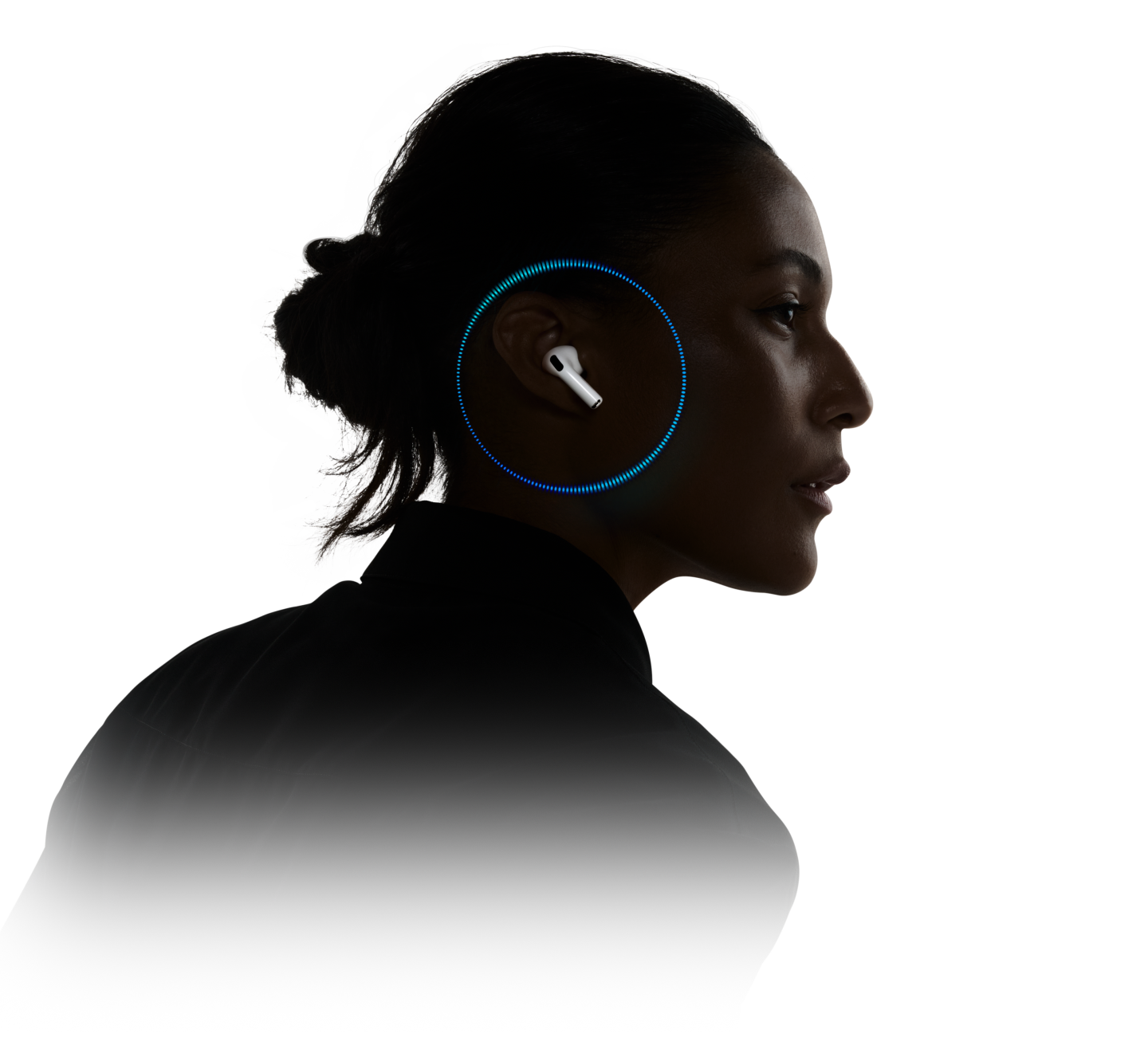 A person wearing AirPods Pro 3 with sound waves around their ear.