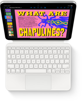 Pohled shora na iPad sp?ipnuty k?bílému Magic?Keyboard Foliu.