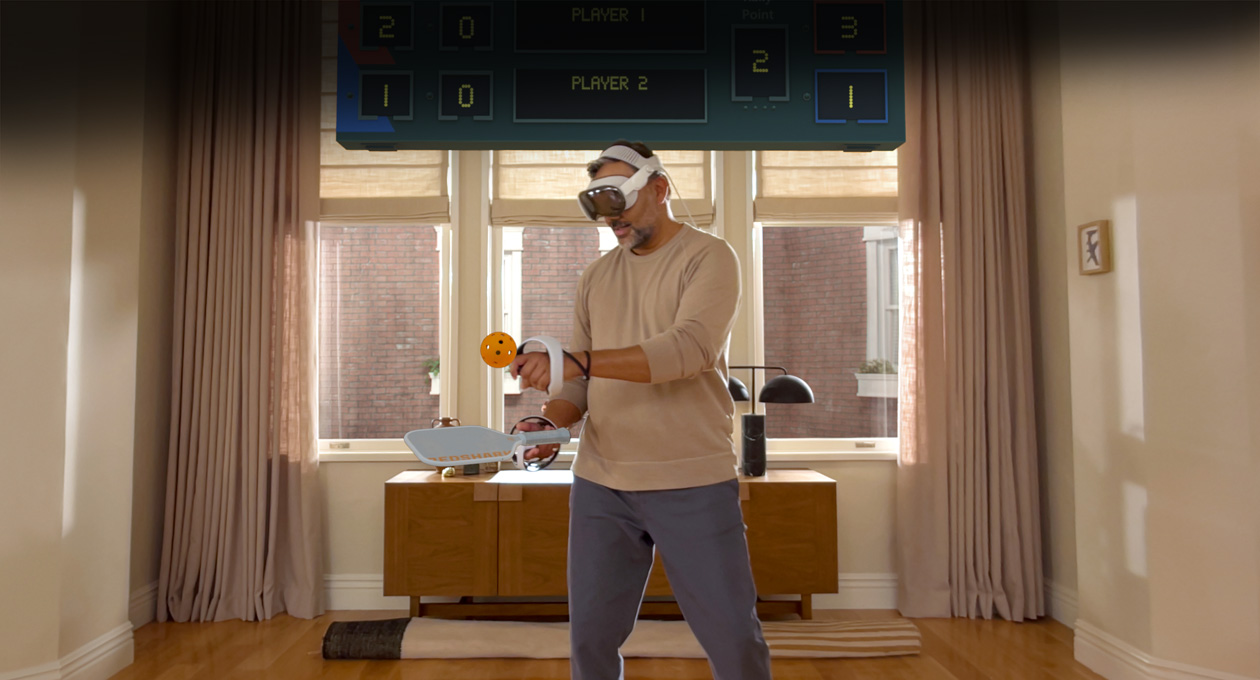 Man wearing Apple Vision Pro and Sony PlayStation VR2 Sense Controller playing: Pickle Pro game, spatial scoreboard above his head